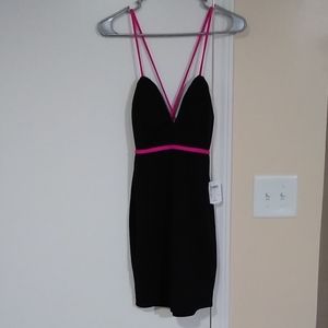 Black mini dress with pink trim